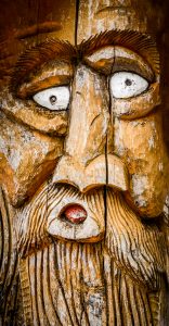 Face Carved Into Wood